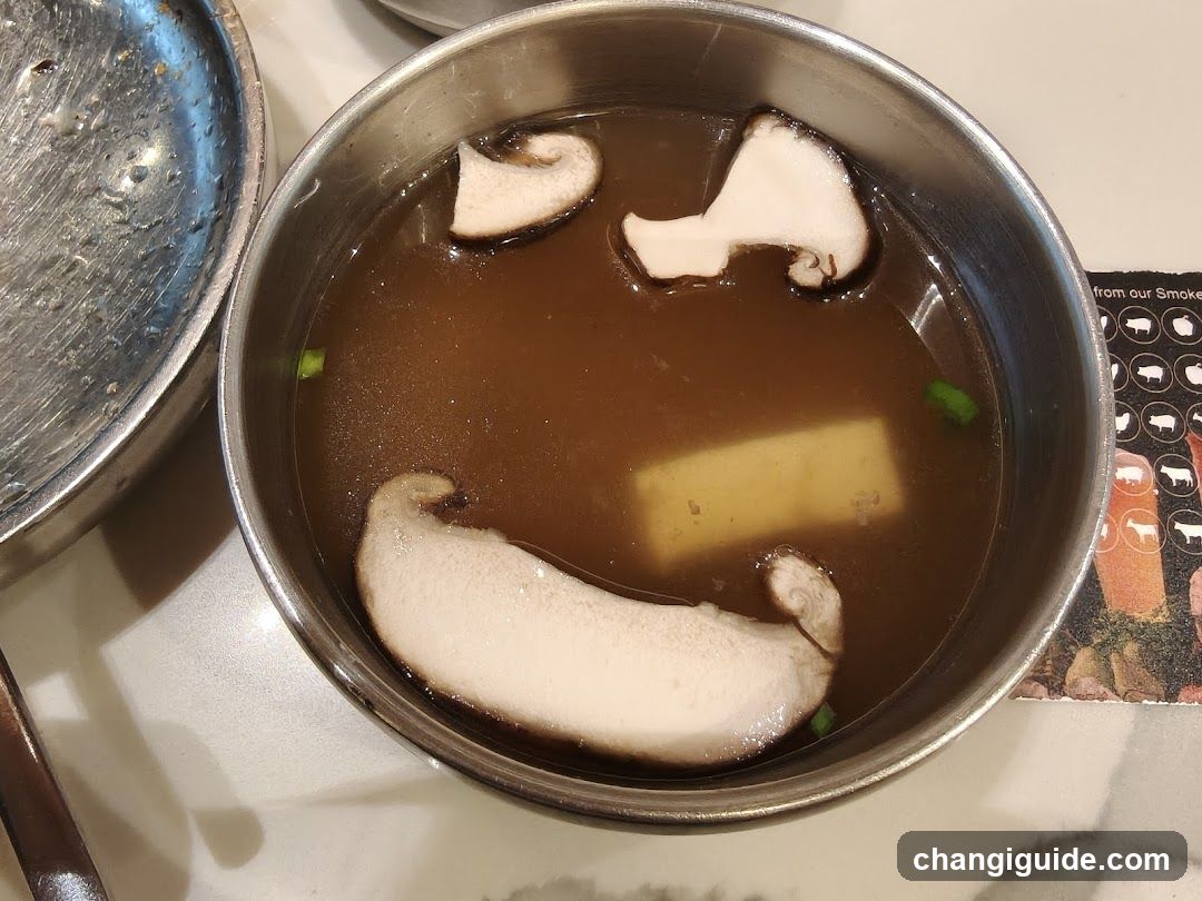 Bowl of Soup with Mushrooms and Tofu
