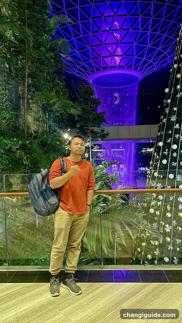 Person in indoor garden setting