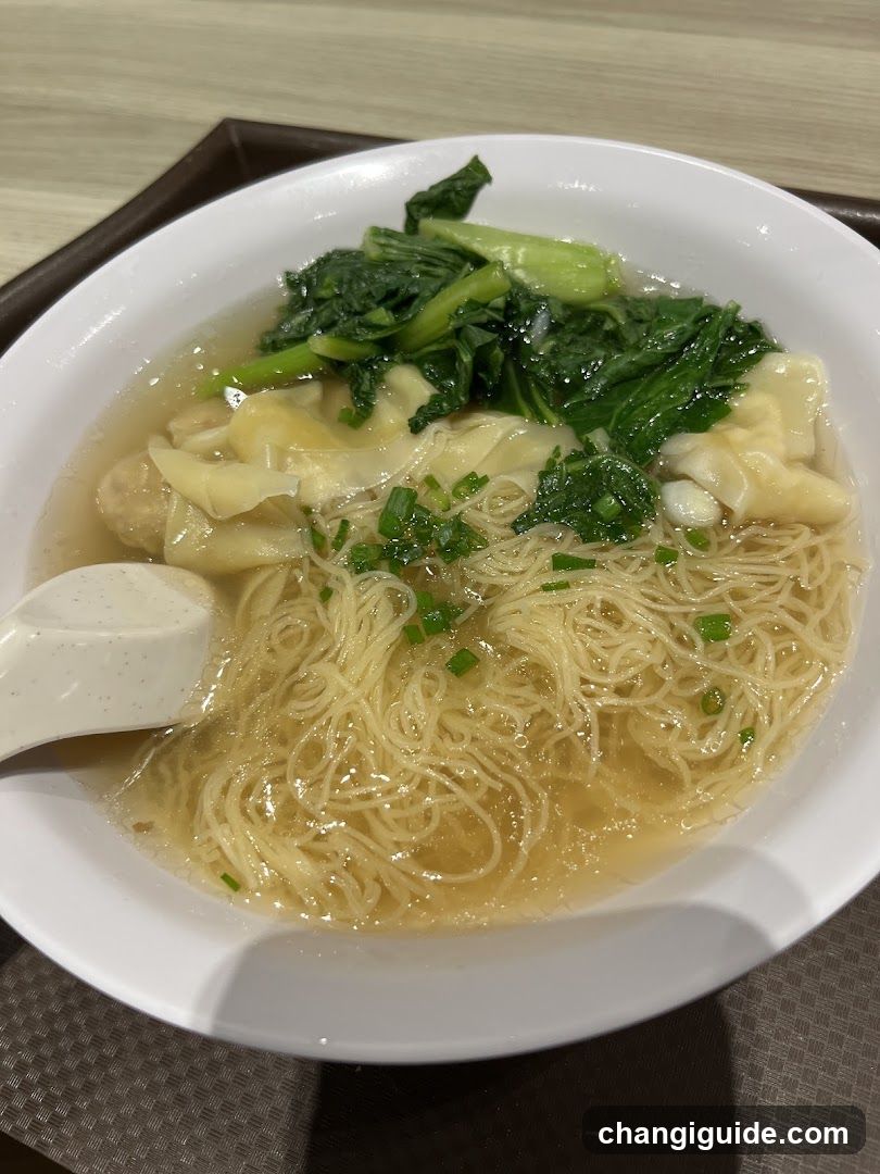 Bowl of Noodles with Wontons and Greens