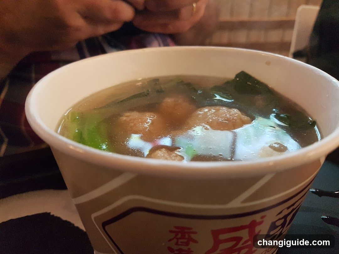 Bowl of Soup with Meatballs and Greens