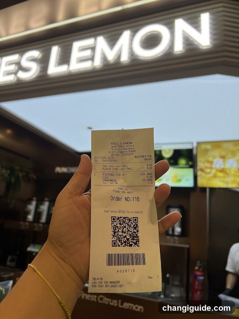 Receipt held in front of Yes Lemon store