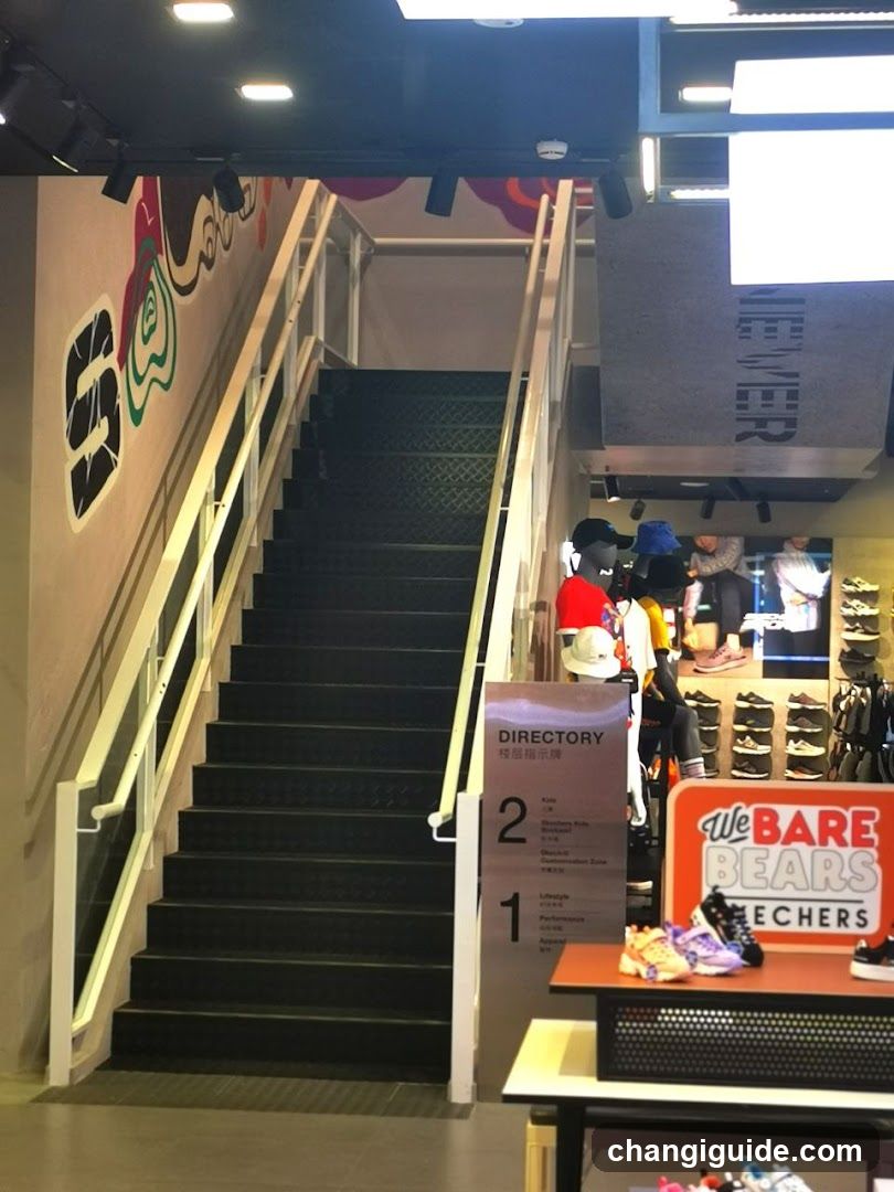 Interior of a shoe store with staircase and merchandise display