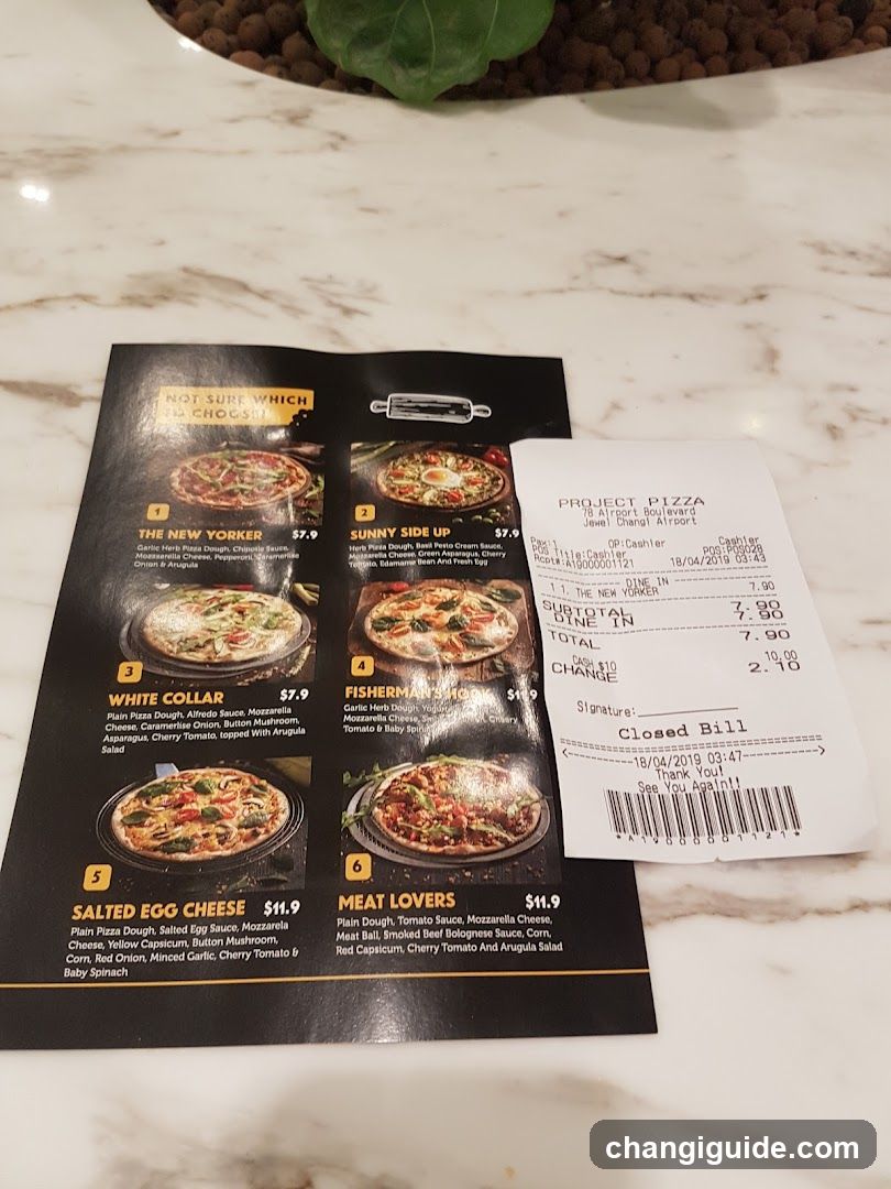 Pizza Menu and Receipt on Marble Table