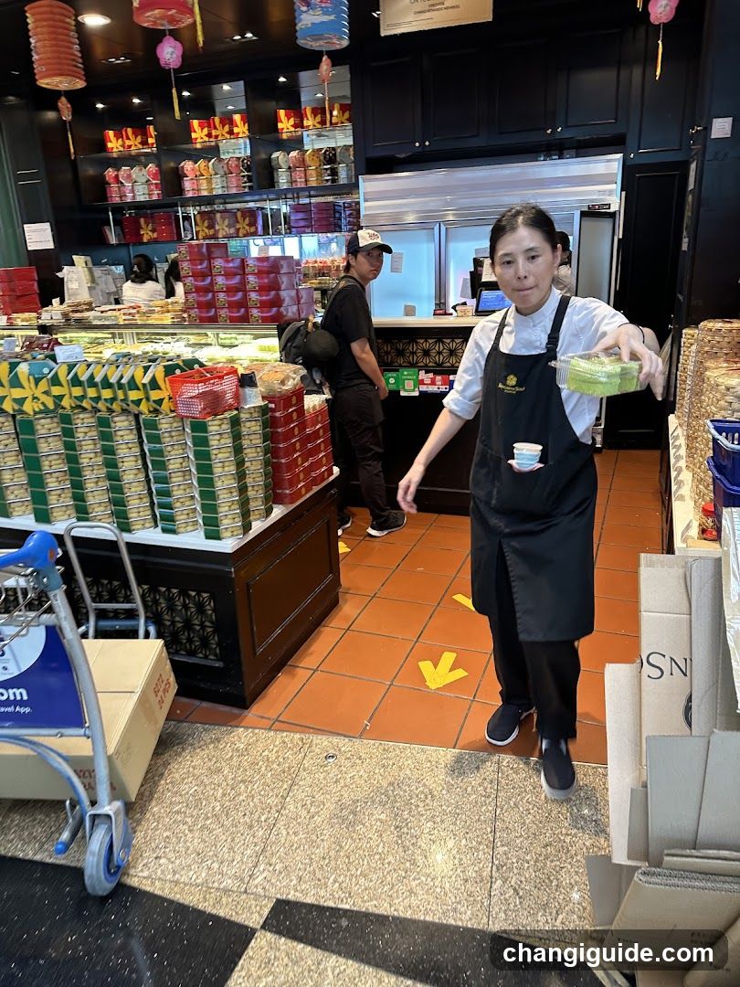 Staff in a store holding food container
