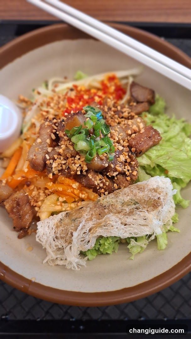 Bowl of Stir-Fried Meat with Noodles and Vegetables