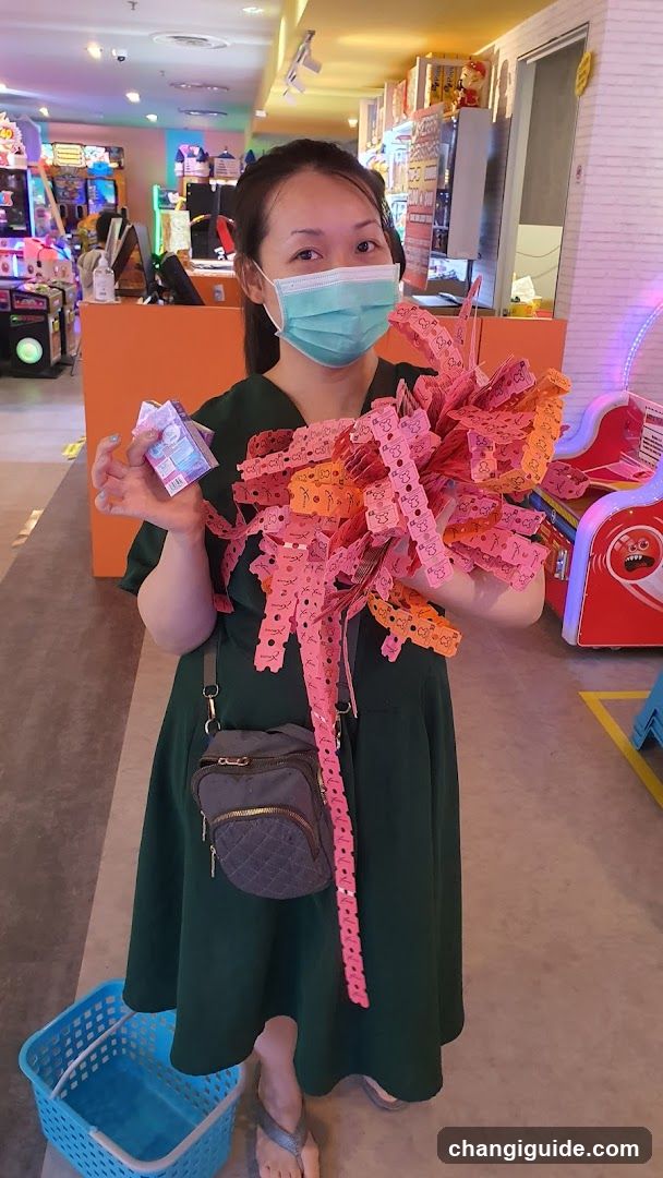 Woman holding game tickets in arcade