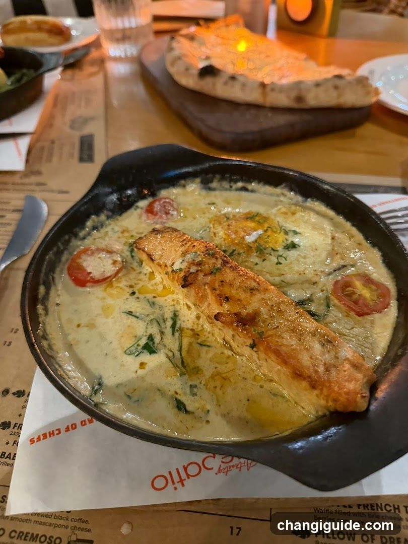 Salmon dish in a skillet at a restaurant
