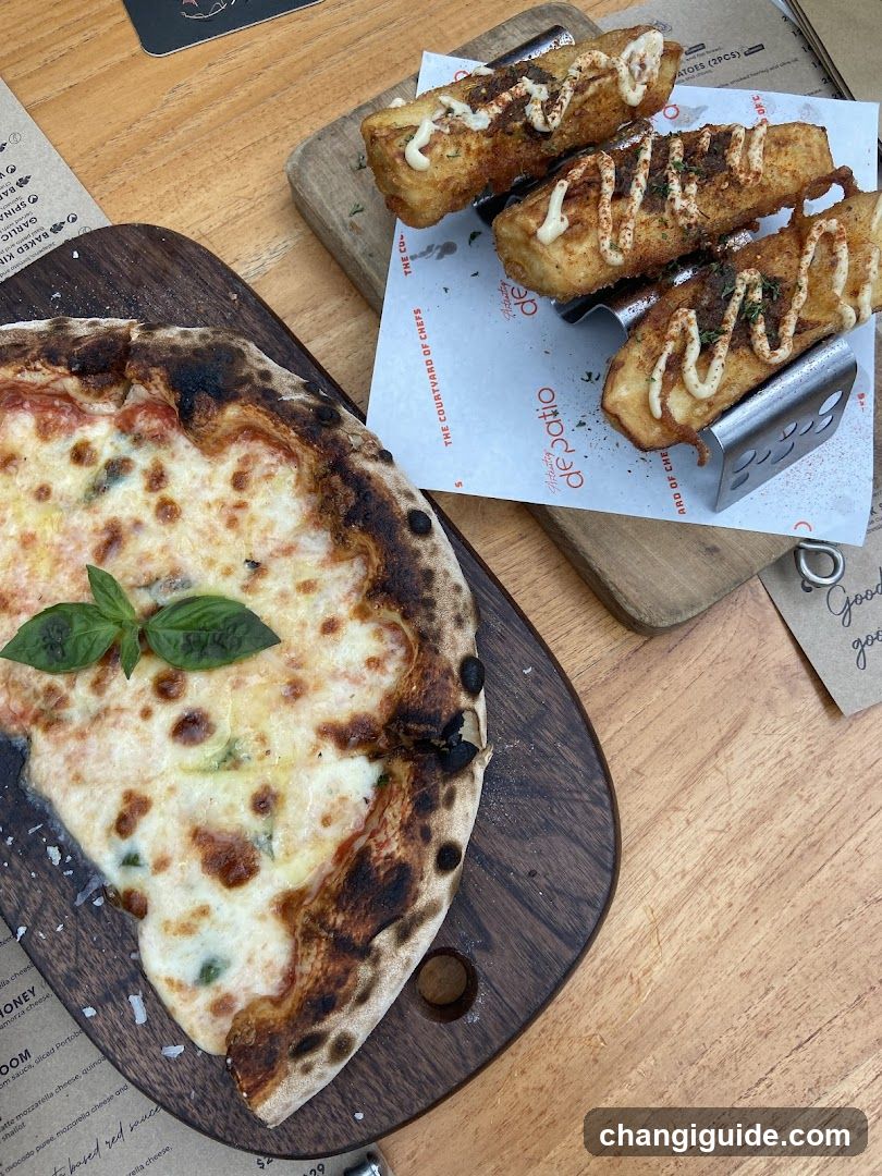 Pizza and Fried Fish at a Restaurant