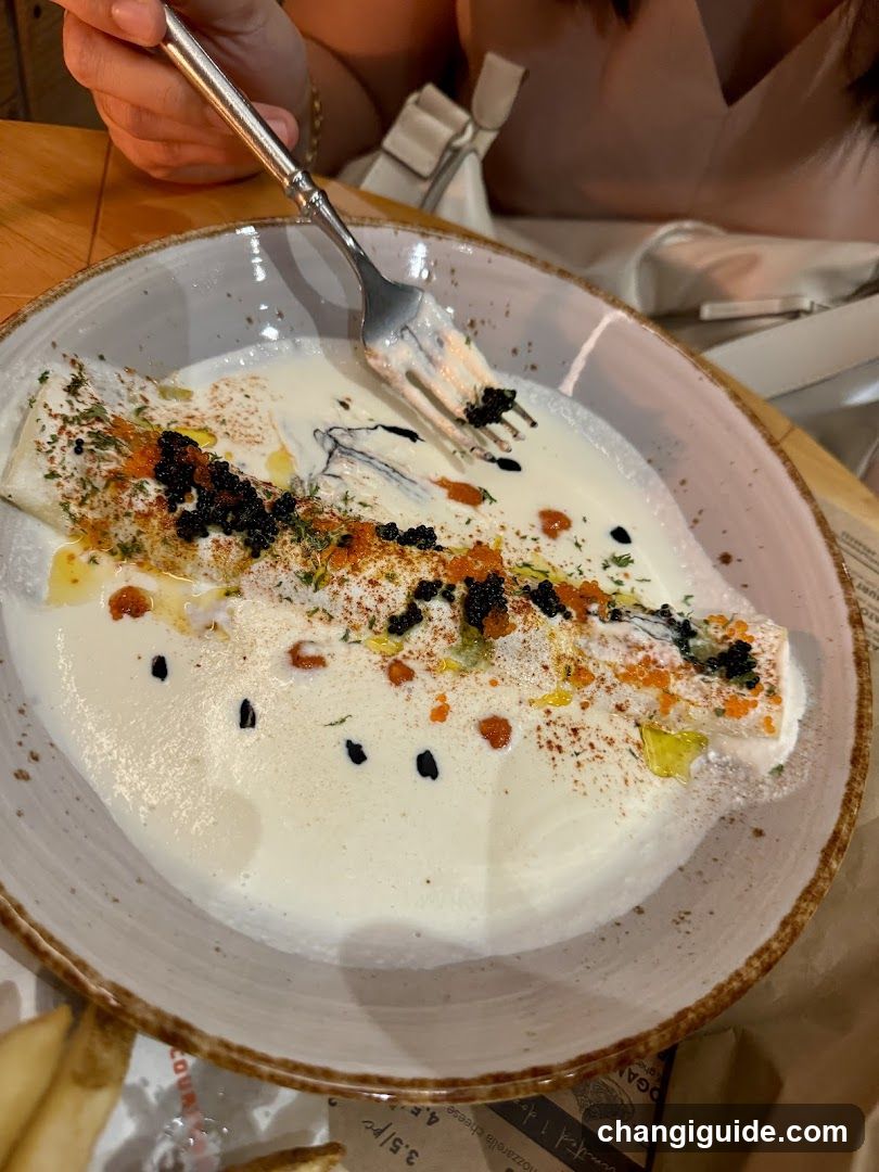 Fish dish with sauce and garnish