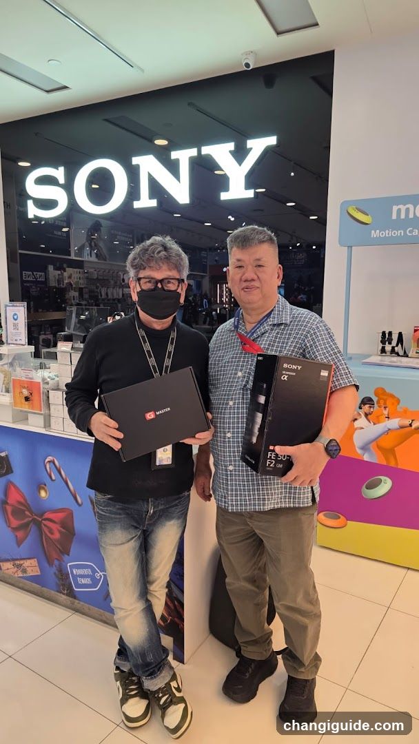 Sony Store Interior with Two Men Holding Products