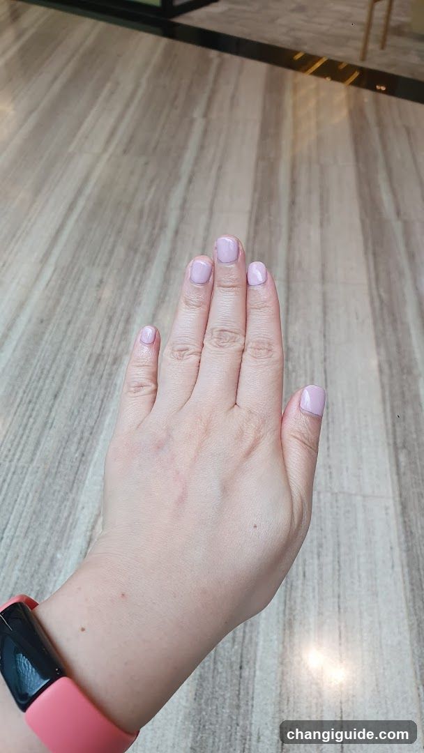 Hand with Pink Nail Polish