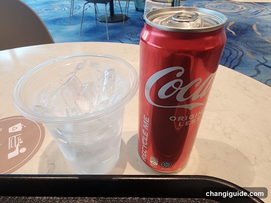 Coca-Cola Can and Ice Cup on Table