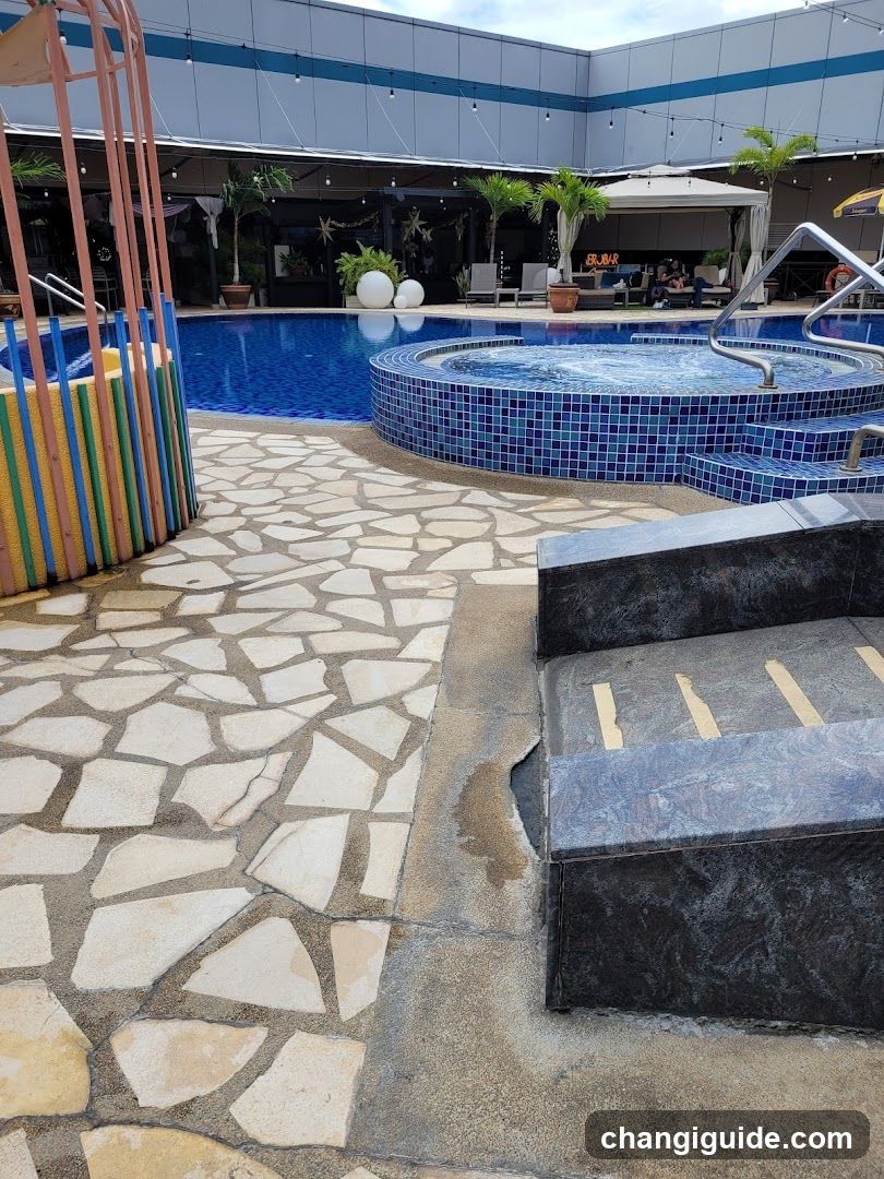 Pool Area with Hot Tub and Patio Seating