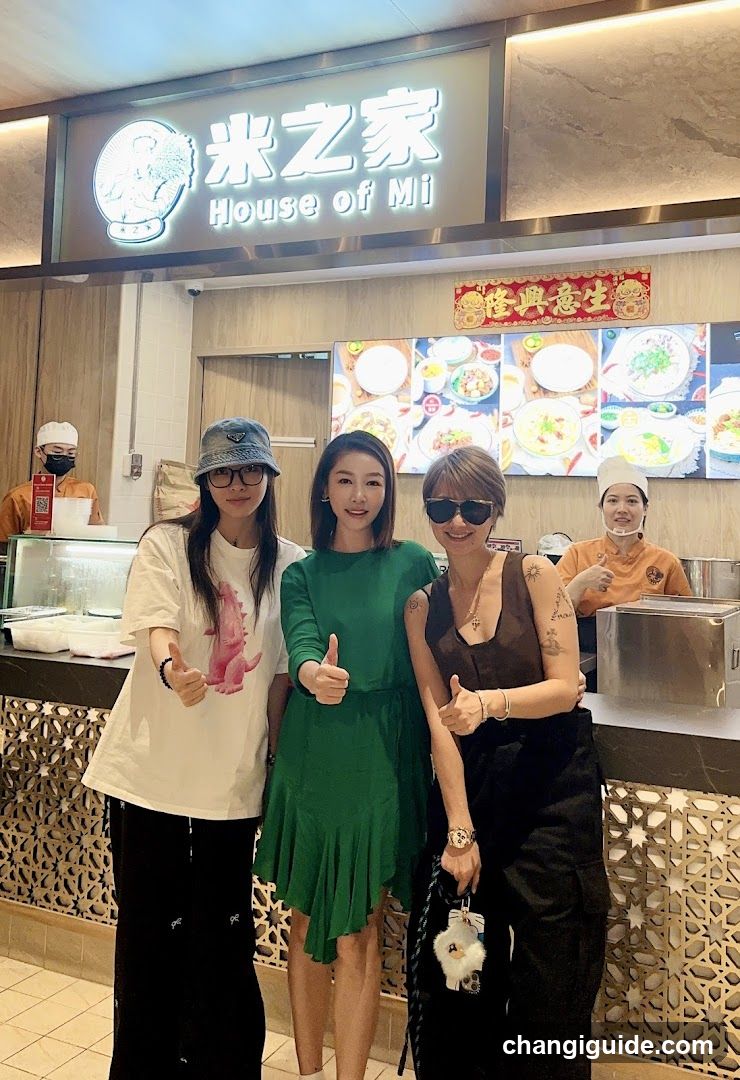 Three women posing in a restaurant