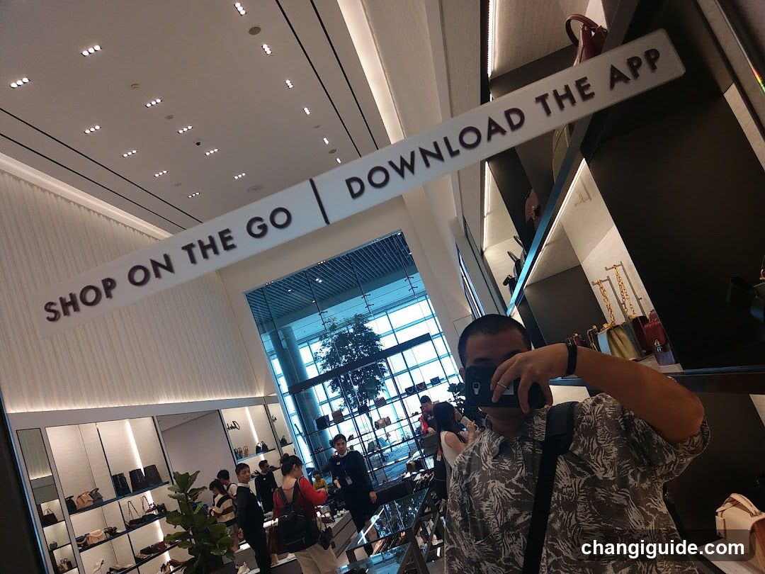 Shopping Mall Interior with App Promotion Signage