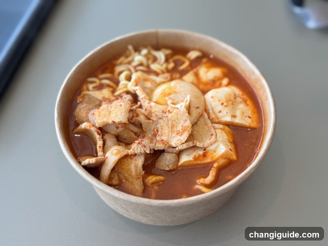 Bowl of Spicy Ramen with Tofu and Pork
