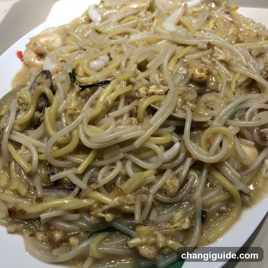 Stir-fried noodles with seafood and egg