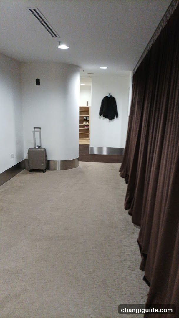 Interior hallway with luggage and coat rack
