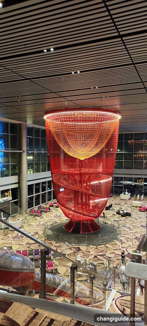 Red Spiral Sculpture in Airport Terminal