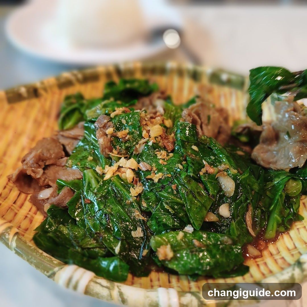 Stir-fried greens with minced garlic and meat