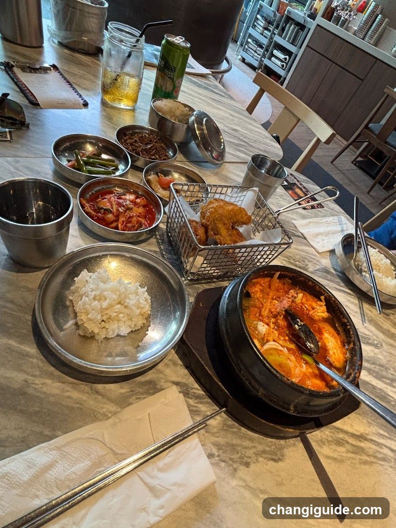 Korean Table Setting with Side Dishes and Fried Chicken
