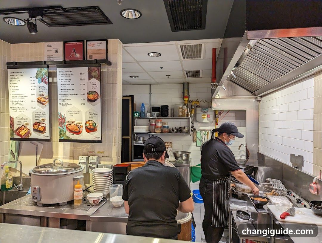 Kitchen Interior with Staff Cooking