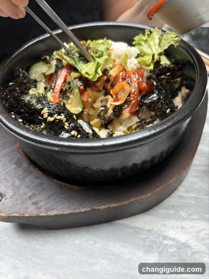 Bowl of Korean-style rice with vegetables and seaweed
