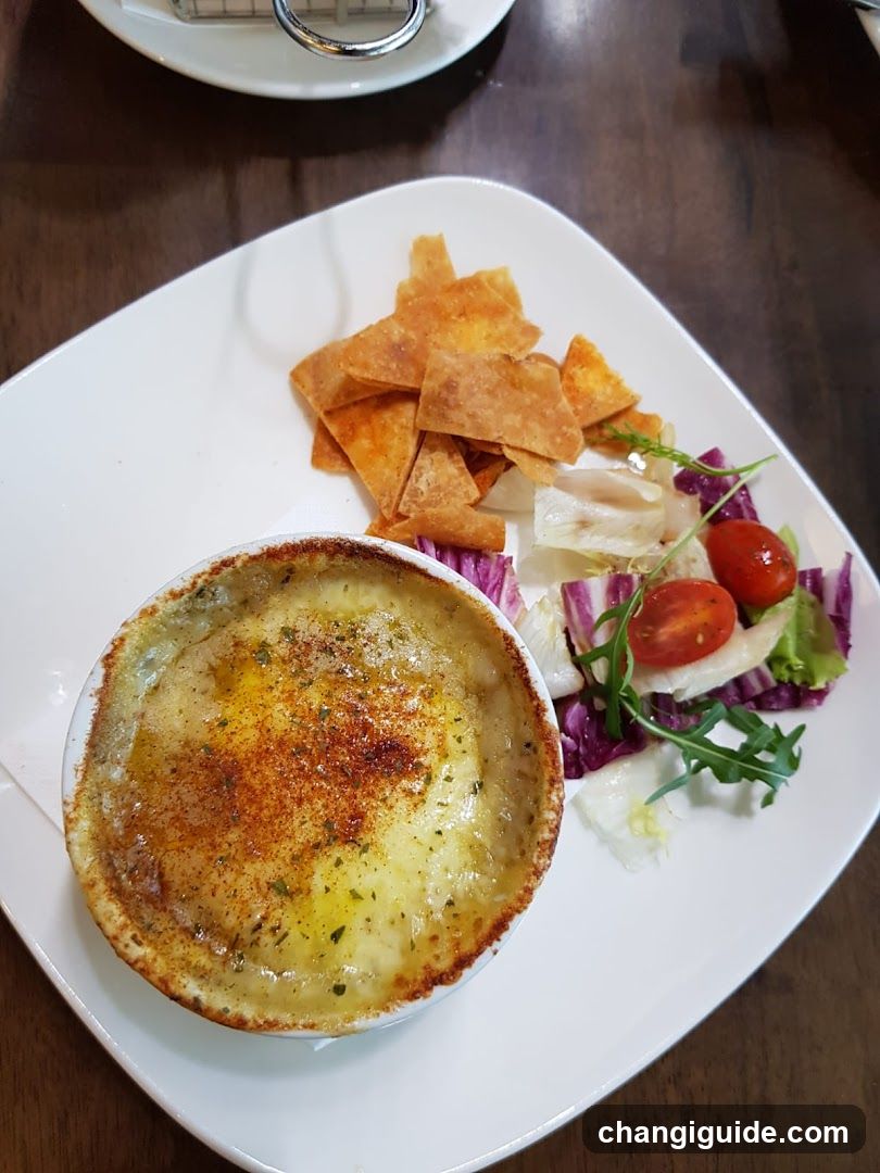 Baked Dish with Chips and Salad