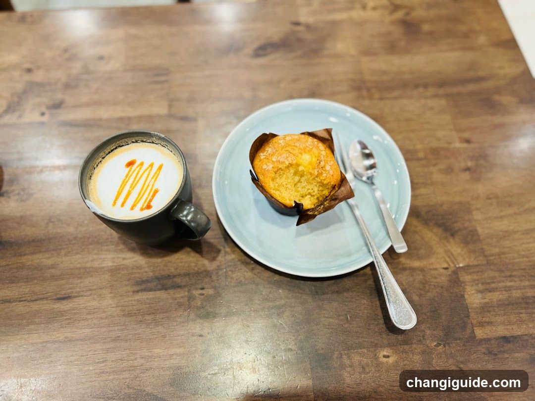 Coffee and Muffin on Wooden Table