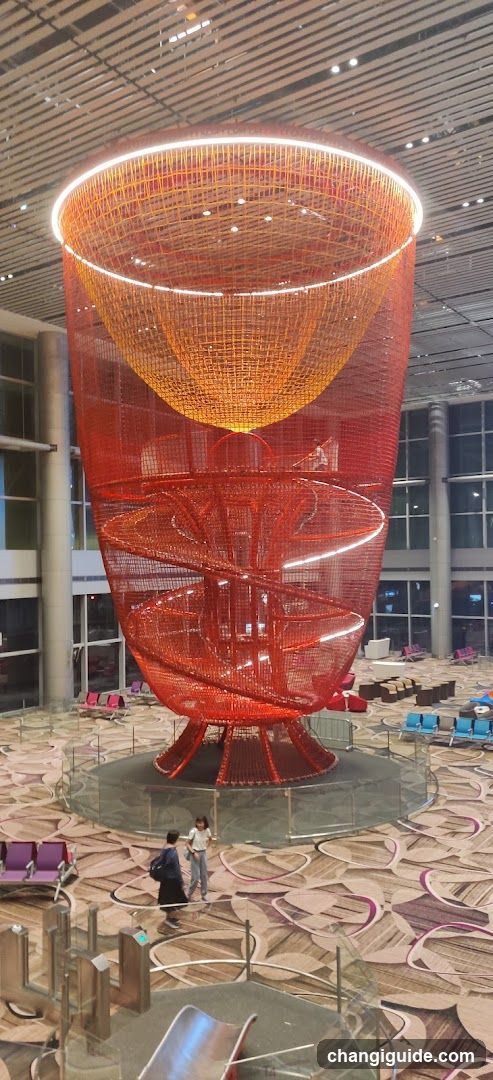 Large Red Sculpture in Airport Terminal