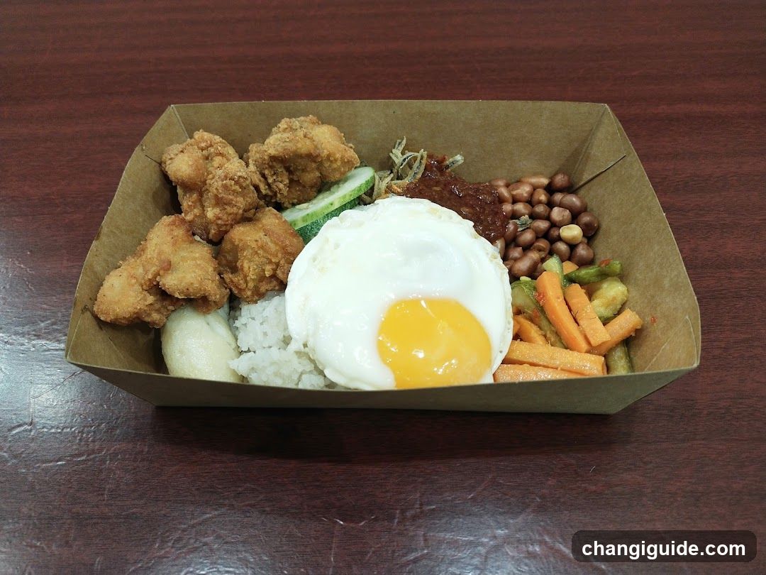 Fried Chicken Rice Bowl with Fried Egg and Vegetables