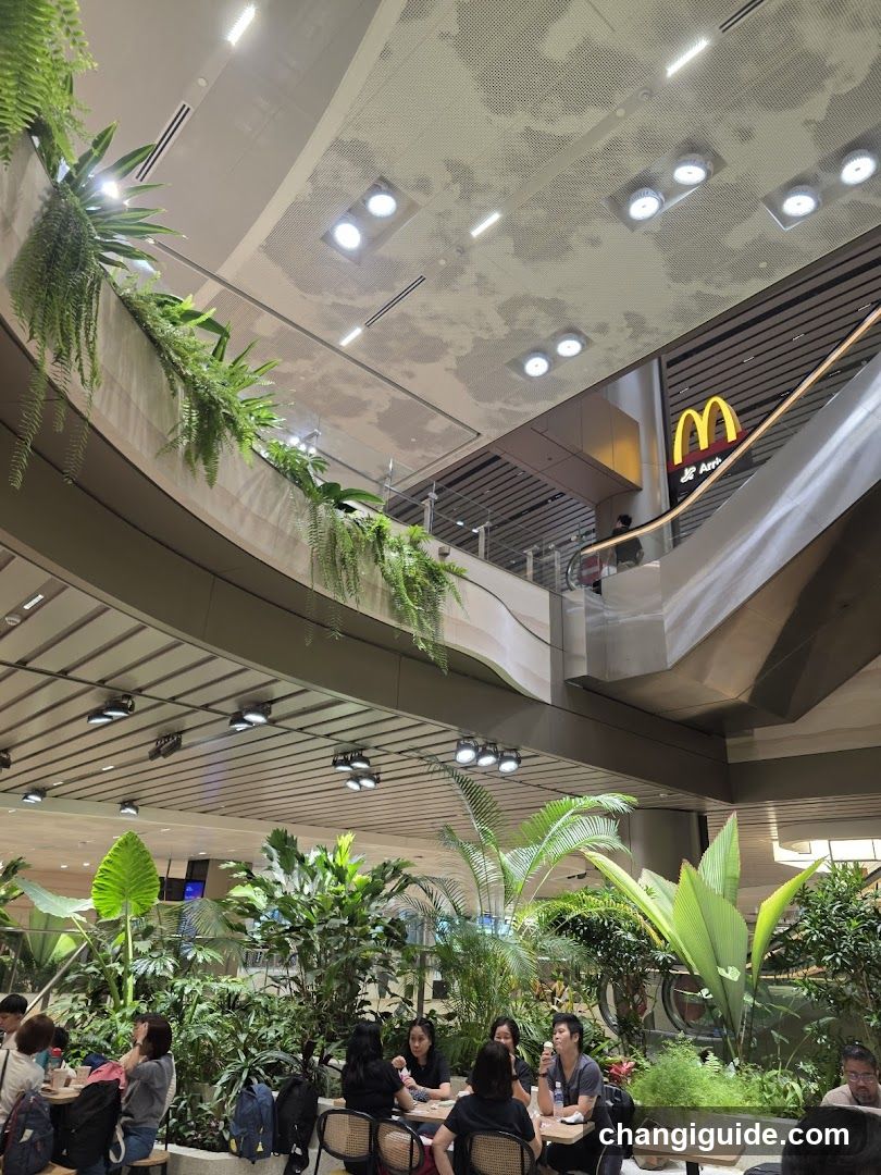Mall Interior with Greenery and McDonald's Sign