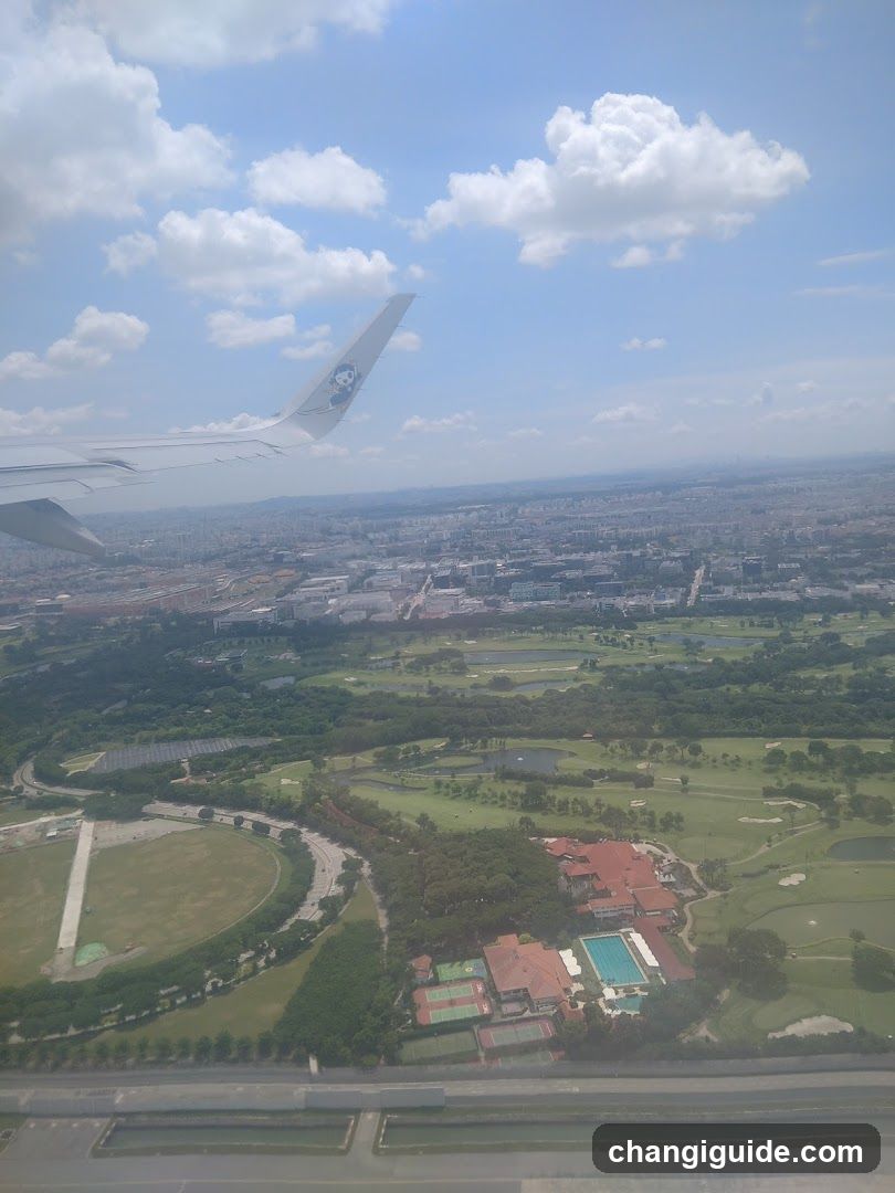 Aerial View of City and Park from Airplane Window