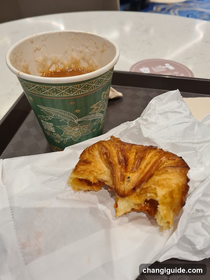 Croissant and Coffee Cup