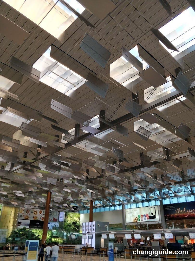 Airport Terminal Interior with Hanging Artwork