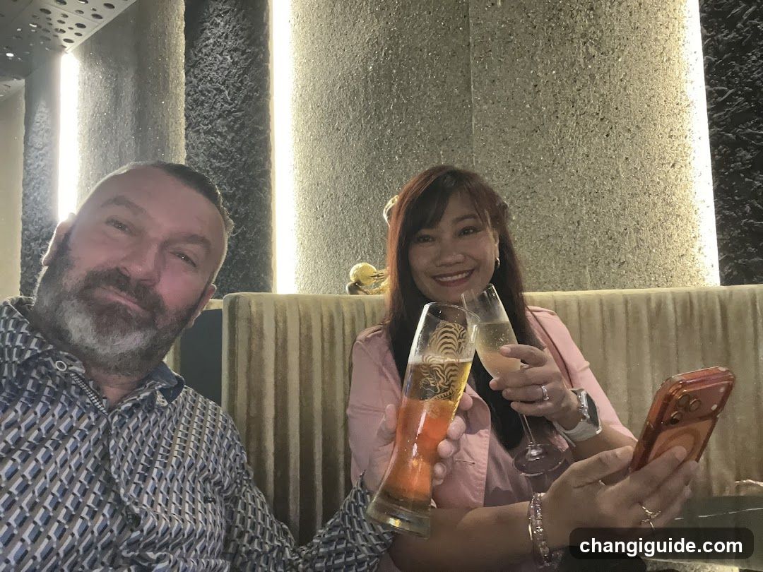 Two people toasting in a bar or lounge