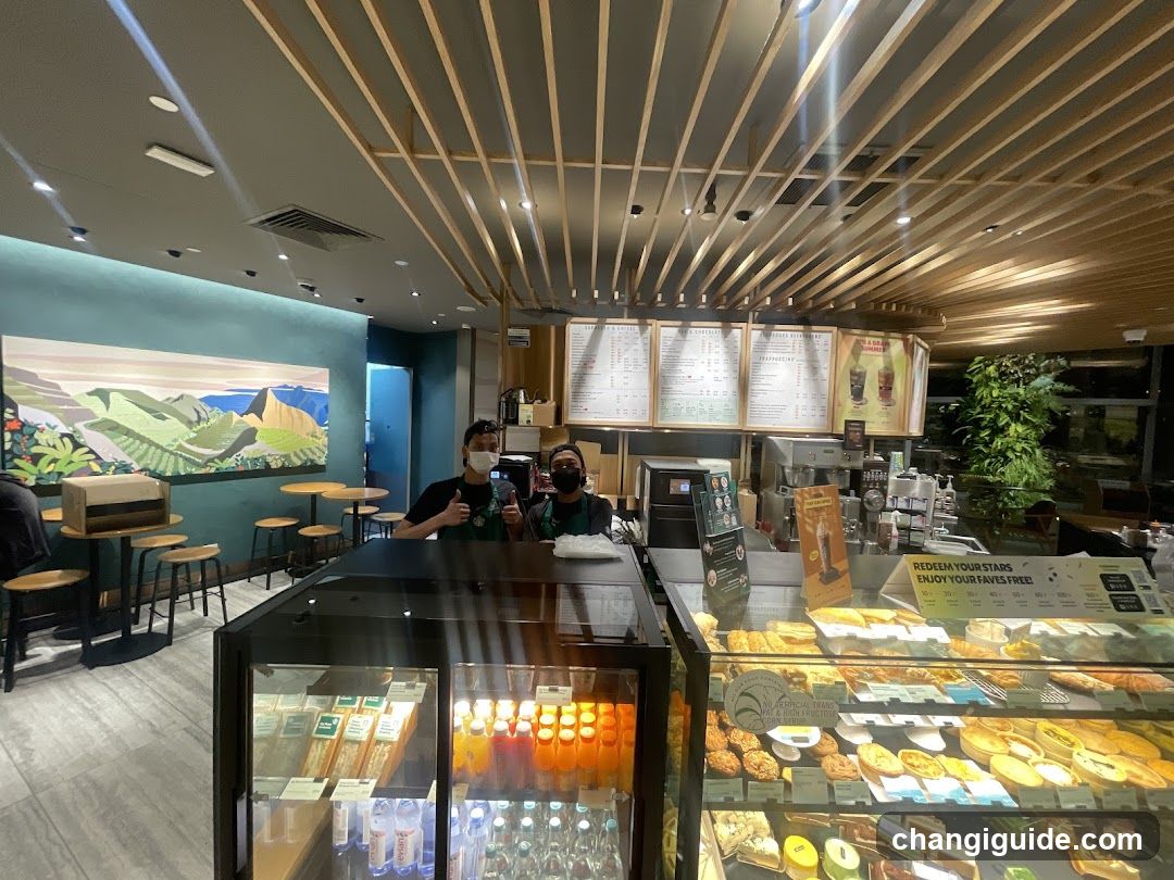 Coffee Shop Interior with Staff and Display Cases