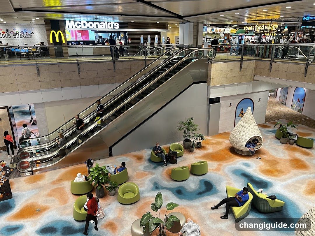 Shopping Mall Interior with Escalator and Seating Area