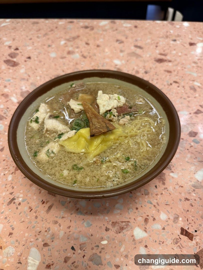 Bowl of Noodle Soup with Egg and Meat