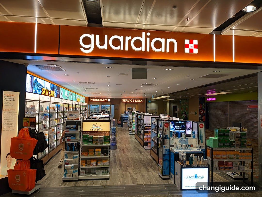 Interior view of a Guardian pharmacy with visible signage, product displays, and service desk.