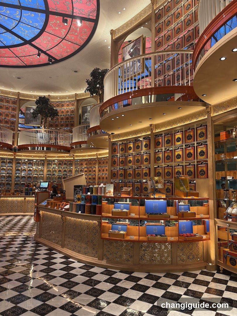 Interior of a luxury store with checkered floor and stained glass ceiling