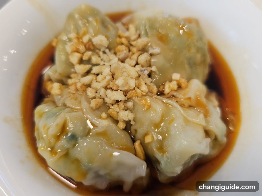 Dumplings with Sauce and Crispy Toppings