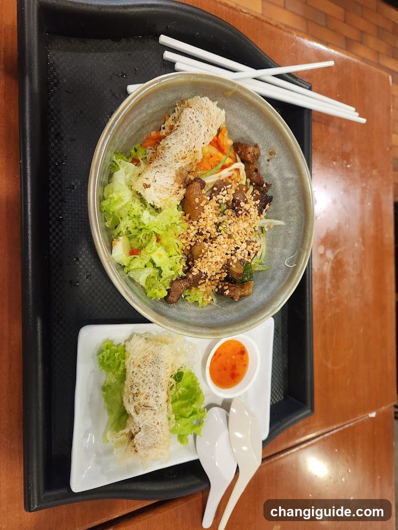 Bowl of food with side dish and dipping sauce
