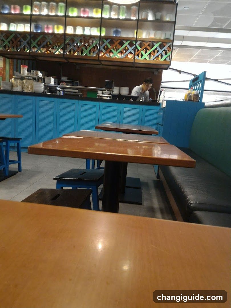 Restaurant Interior with Blue Cabinets and Wooden Tables