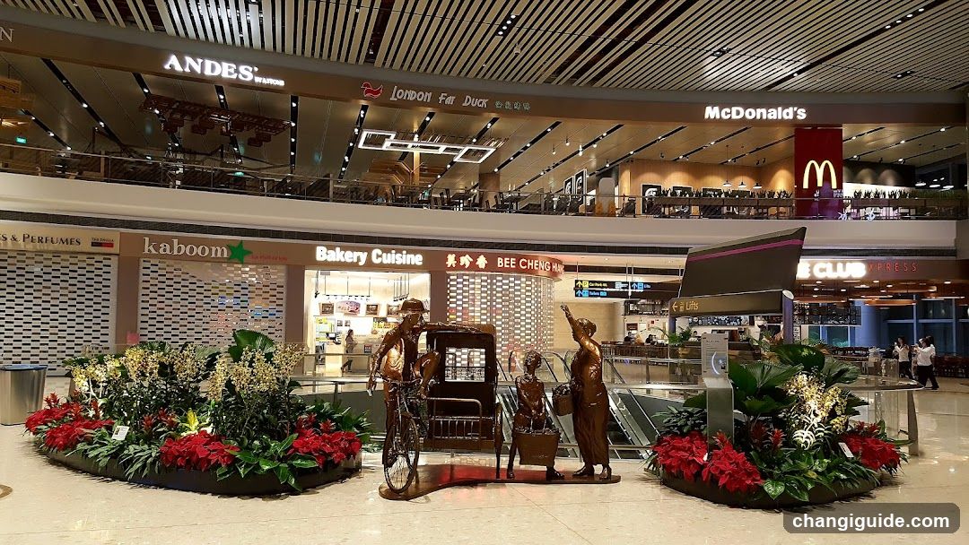 Airport Terminal Interior with Shops and Sculpture