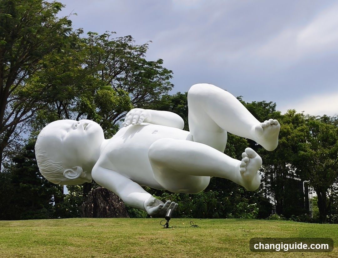 White Baby Sculpture in Park