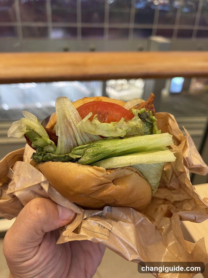 Handheld Sandwich with Lettuce and Tomato