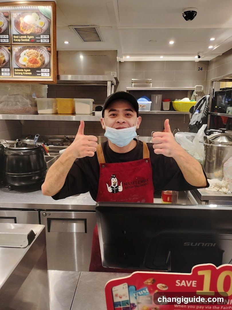 Staff in Kitchen Giving Thumbs Up