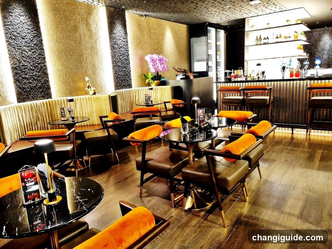 Bar Interior with Orange Upholstered Chairs and Black Tables