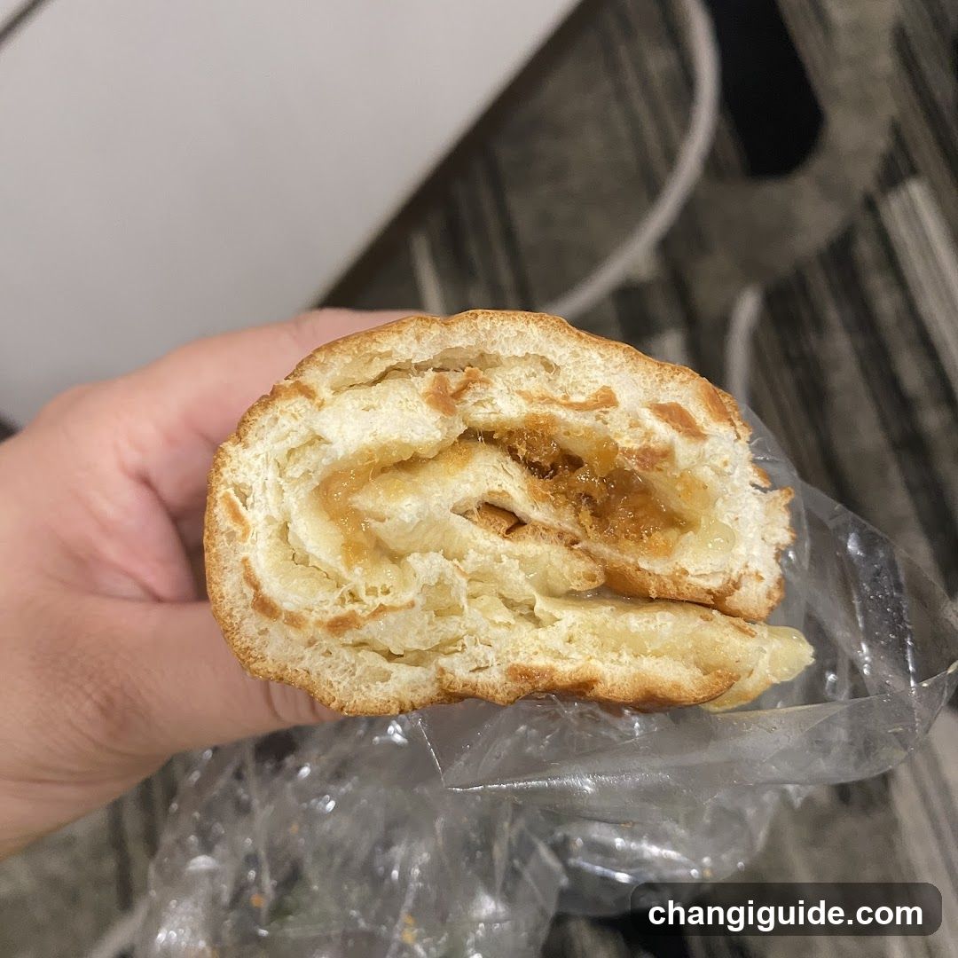 Hand holding a pastry